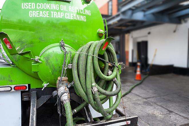 a grease trap being pumped out by a professional service in Sharonville OH